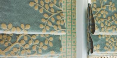The Design Gallery creates blue embroidered custom drapery window treatments