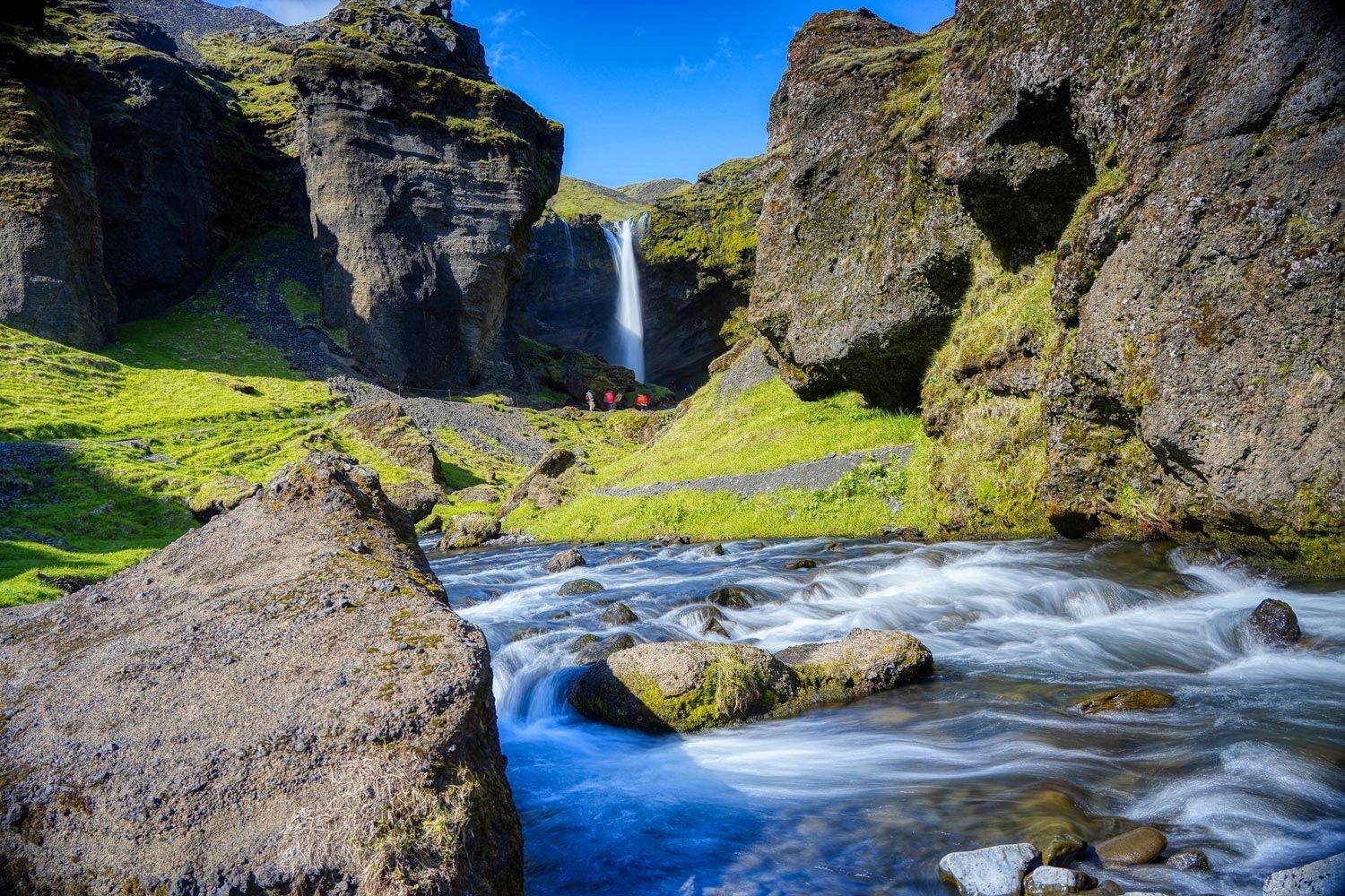 Image of the Kvernufoss waterfall with flowing river in the foreground.  Photographed in southern Ic