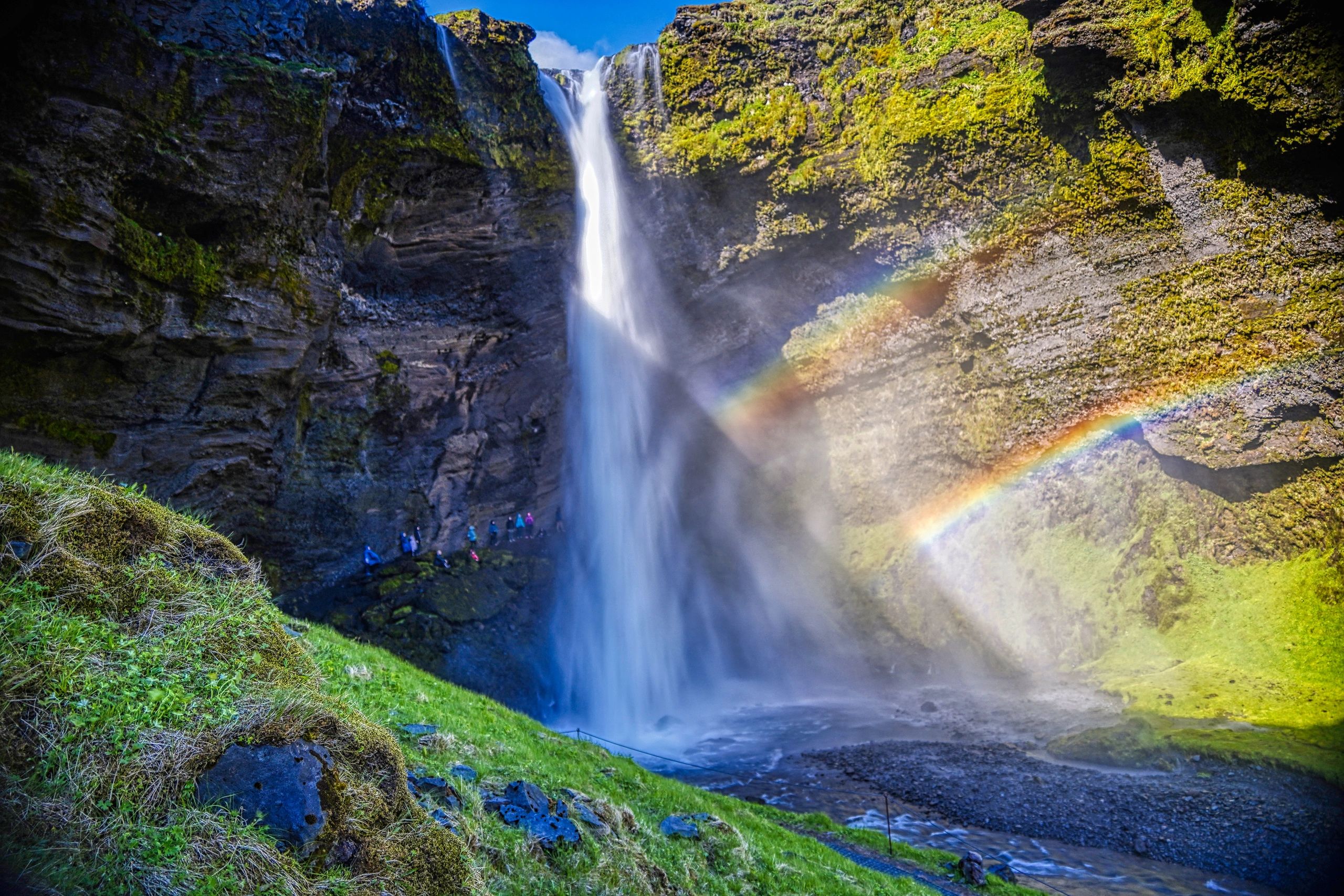 Image of the Kvernufoss waterfall with a double rainbow in southern Iceland.  2023