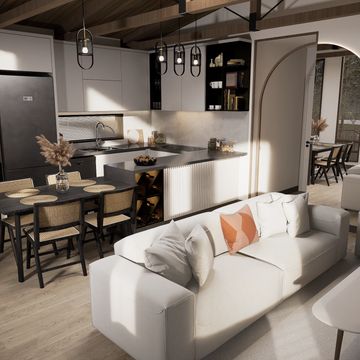 Modern open-concept kitchen and living room with light wood flooring and neutral tones.