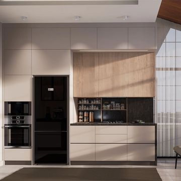 Modern kitchen with sleek cabinetry, black appliances, and large windows letting in natural light.