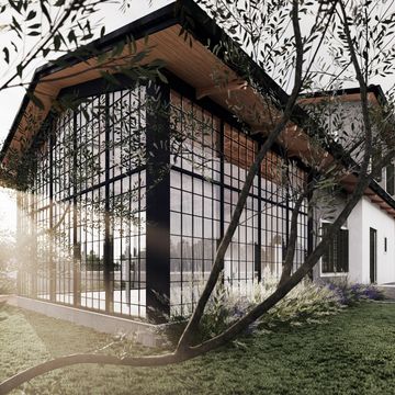 Modern house with large glass windows and a white car parked outside in a green garden.