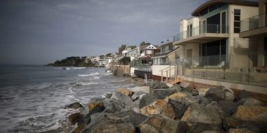 Waves crash against luxury homes on Broad Beach in Malibu on Oct. 27, 2015. Photo by Lucy Nicholson,
