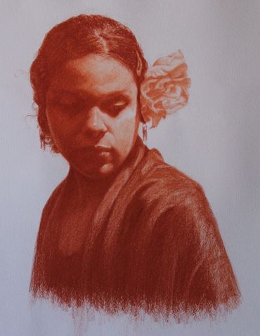 Sanguine soft pastel drawing of young woman with flower in her hair. 