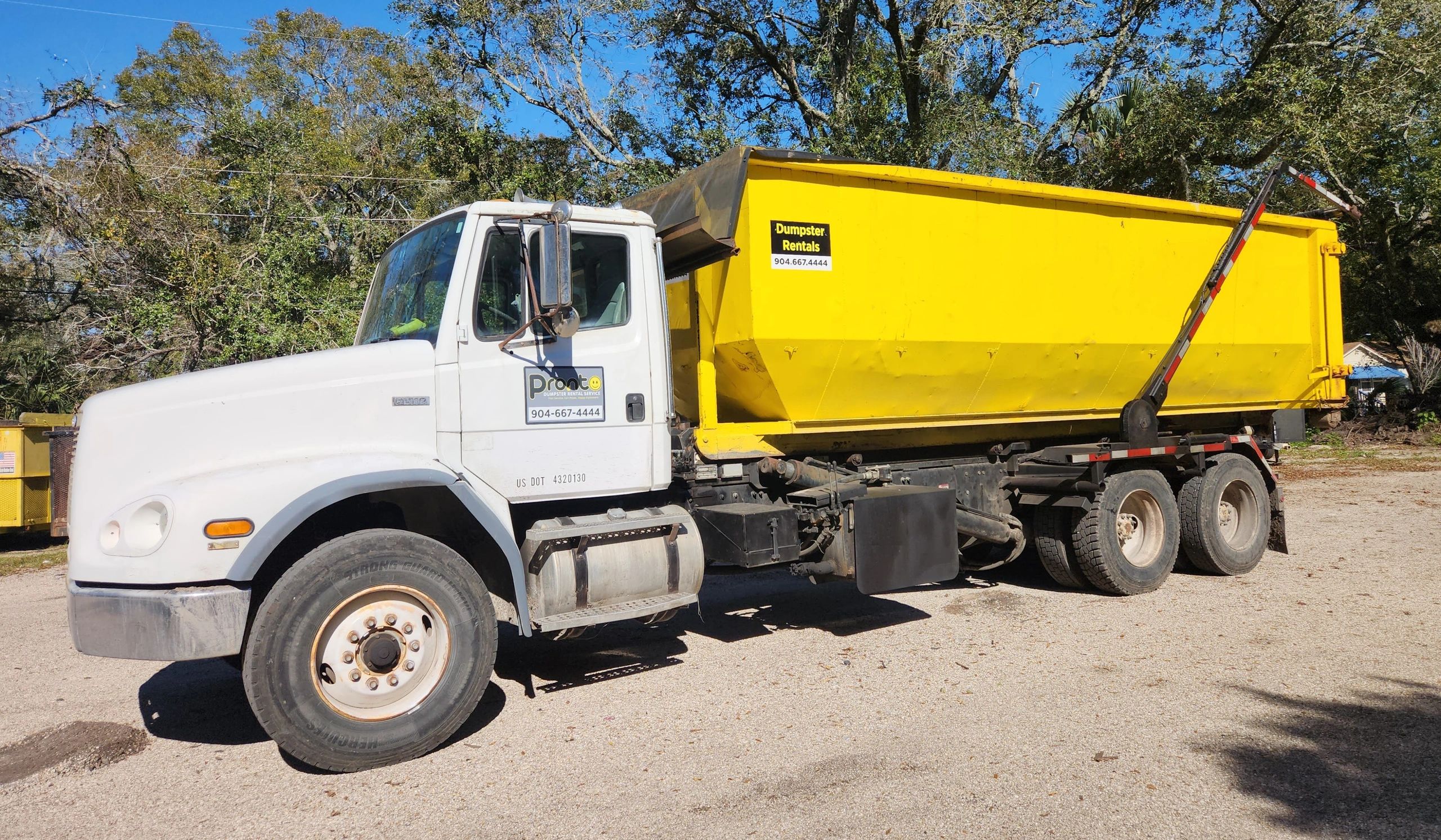 Roll off truck with dumpster