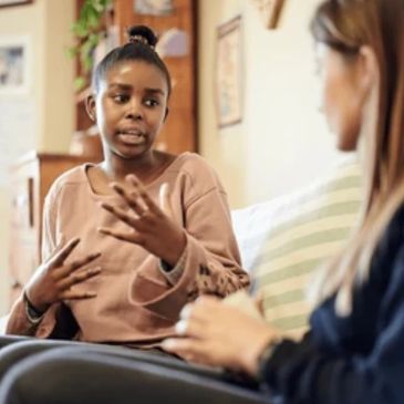 Young woman sharing her thoughts during a counseling session.