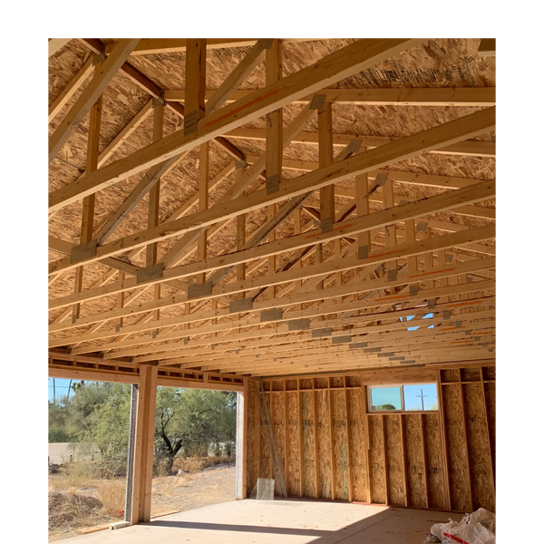 iinside of 3 car garage with framing exposed