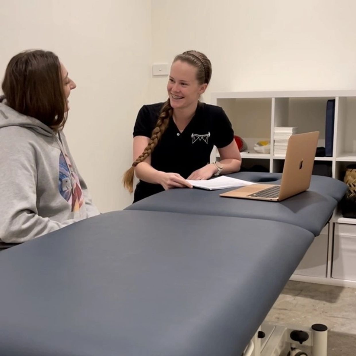 Isabelle speaking with a student