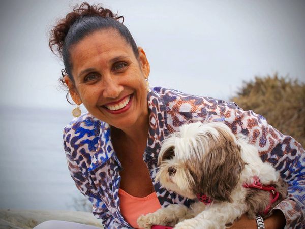 Debra holding her Shih Tzu, Cupcake