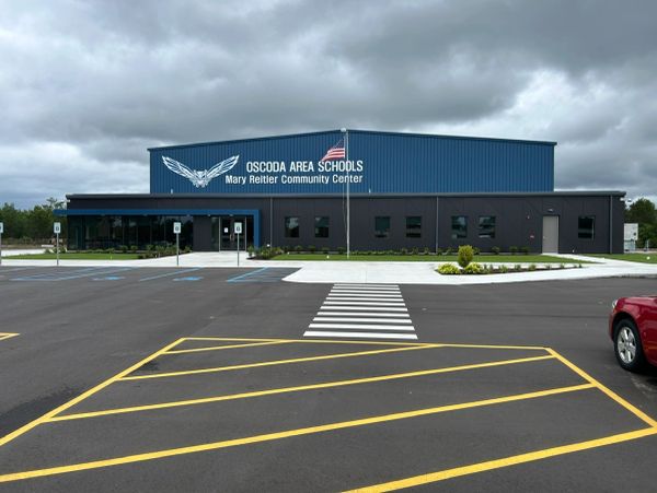 Newly completed community center front entry with American flag