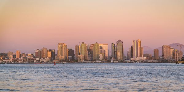 Photo of San Diego, California skyline at sunset from a cruise deck