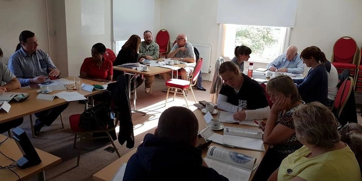 People enjoying a mental health first aid training course.