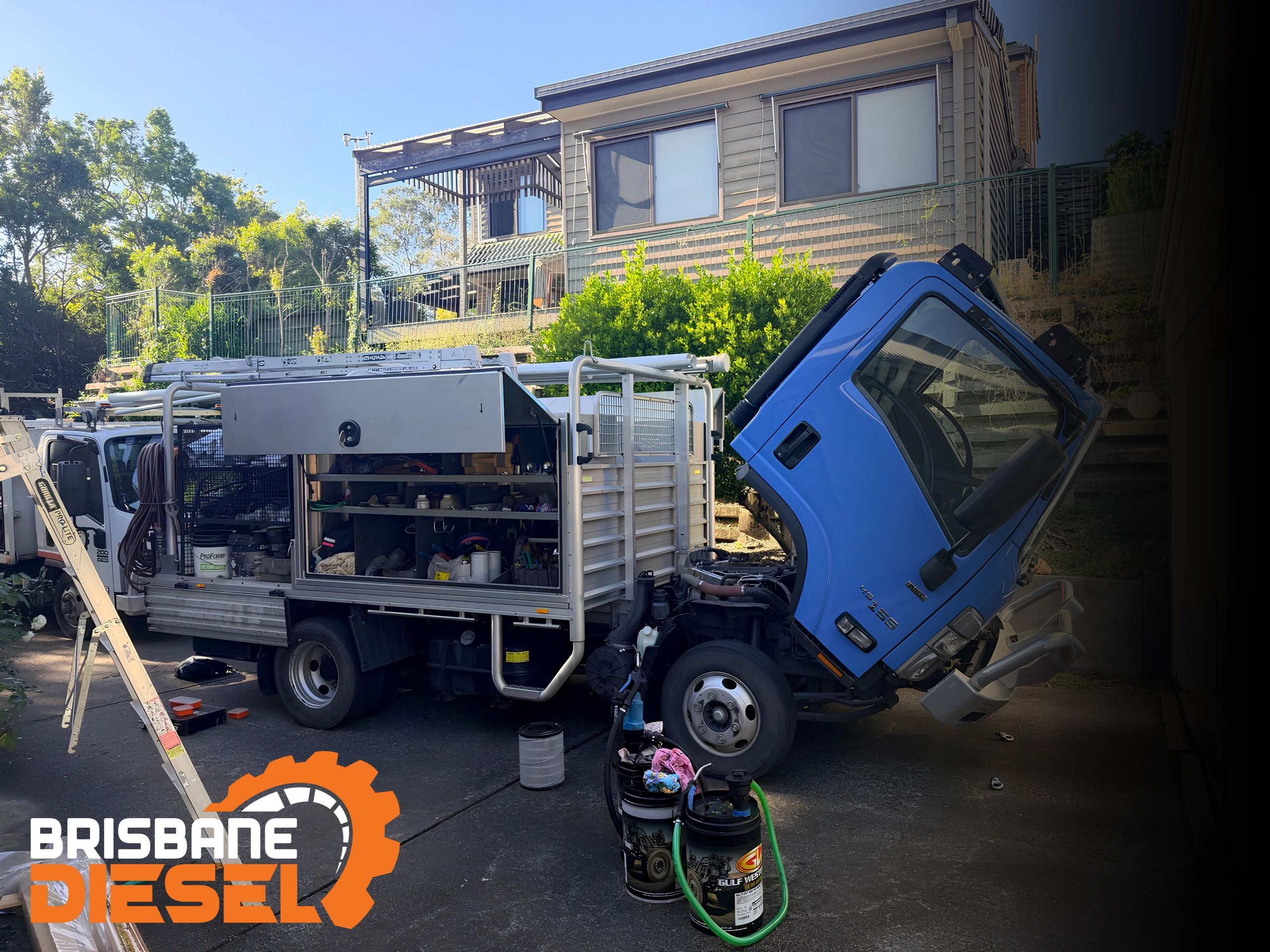 Brisbane Diesel mobile mechanic servicing an Isuzu N Series Tradepack truck on site in Brisbane.