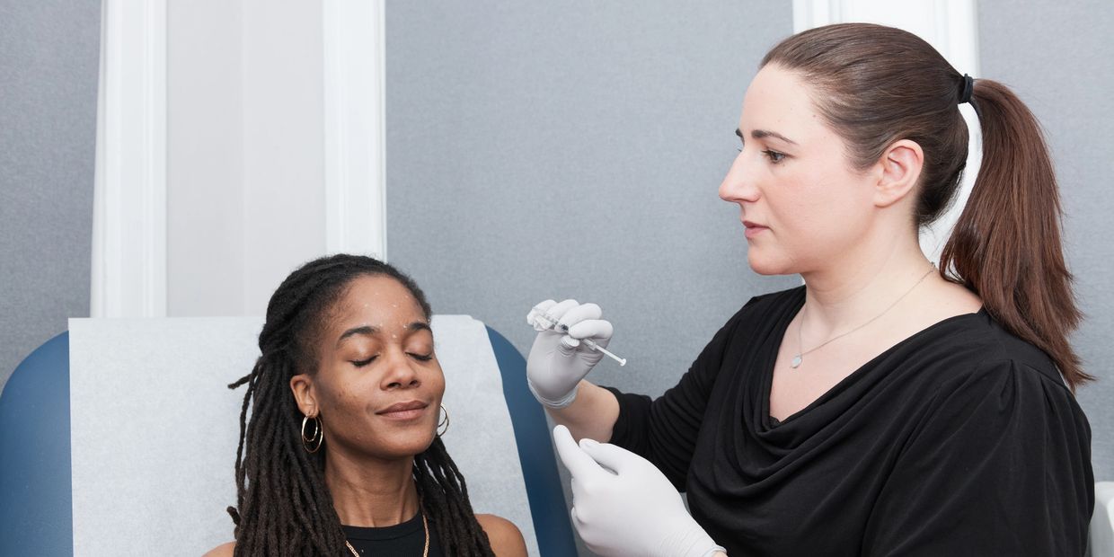 Patient receiving a Botox injection in the forehead from Dr. Gougian.
