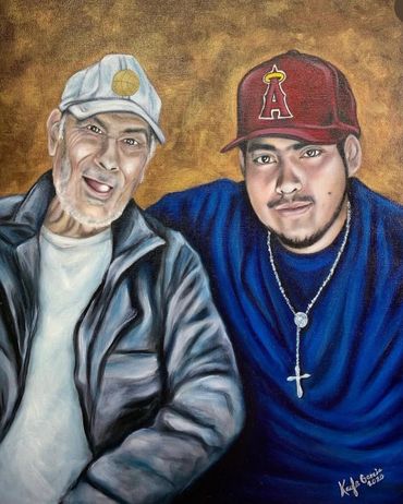 Portrait of two men wearing caps, one older and one younger, smiling warmly.