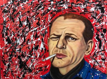 Portrait of a man smoking against an abstract red, black, and white background.