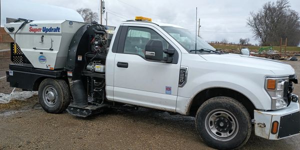 Fleet of sweeper trucks doing parking lot sweeping near me, midwest Wisconsin, Michigan, Minnesota
