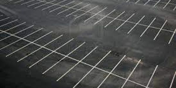 A clean commercial parking lot, all the trash has been swept by lot sweepers inc. 