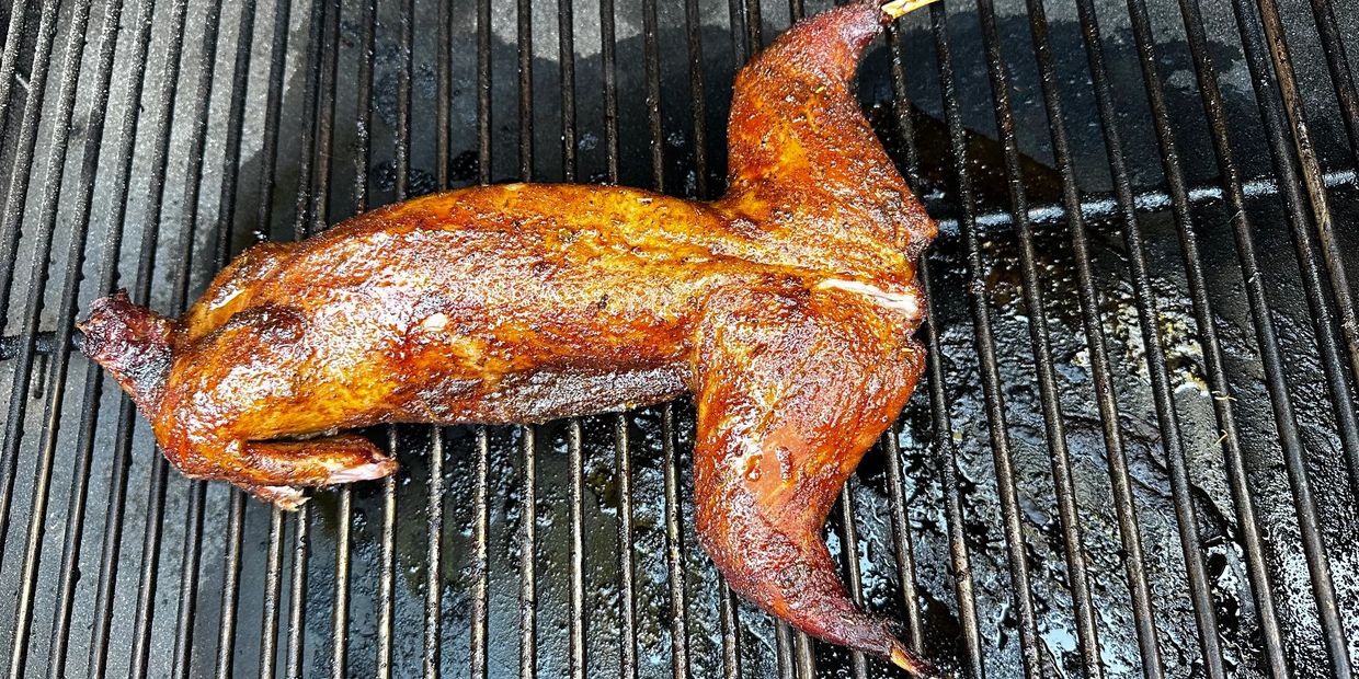 Smoked rabbit cooking on a bbq grill