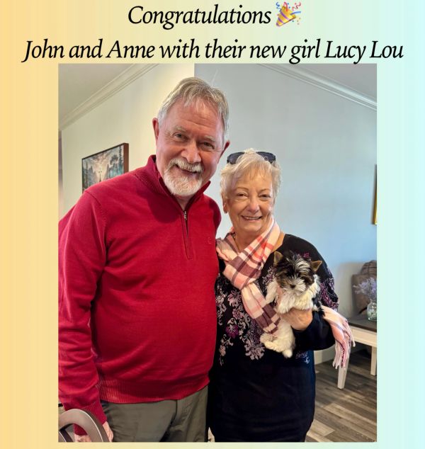 John and Anne happily pose with their new small dog, Lucy Lou.