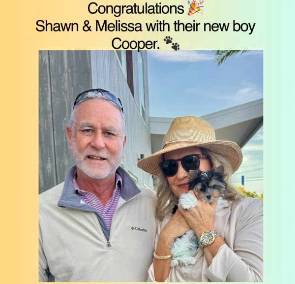 Shawn and Melissa happily welcome their new puppy, Cooper.