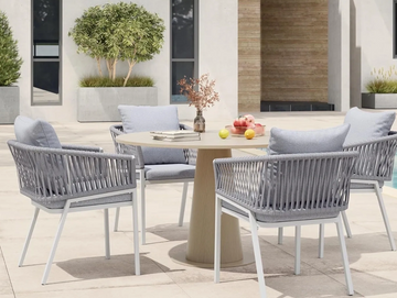 WHite and grey rope aluminium dining chairs and table on an outdoor terrace with a tree in the back