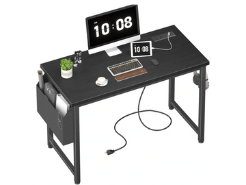 Black writing desk with a saddle side pocket and with electronic gadgets on the desktop