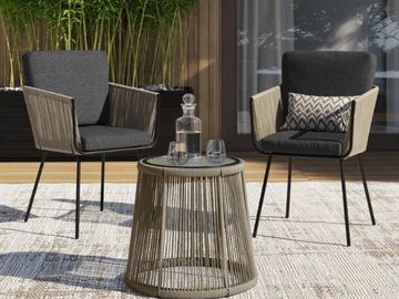 Two Grenada rope chairs with a coffee table on a an outdoor carpet in a verandah