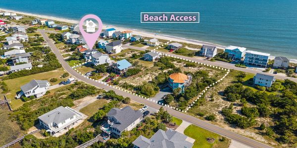 Aerial view of a coastal neighborhood with beach access indicated.