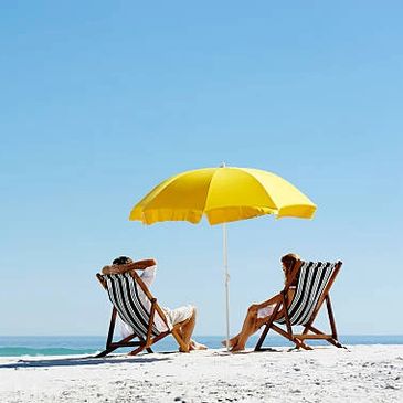 Beach chairs and umbrellas available for guests