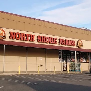 Exterior view of North Shore Farms grocery store with clear signage.