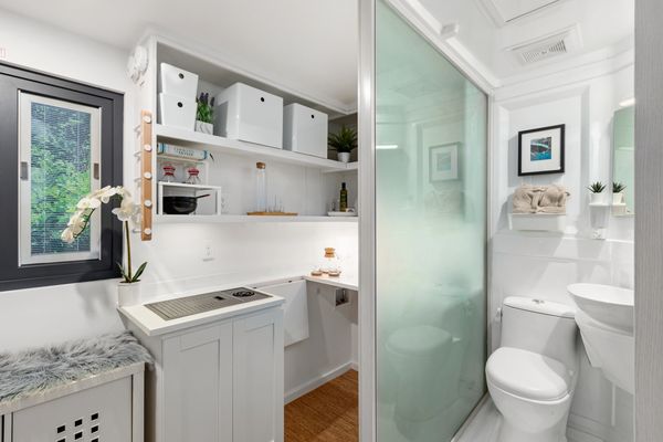 Interior view of the detachable ADU tiny home, full bathroom next to the kitchen area