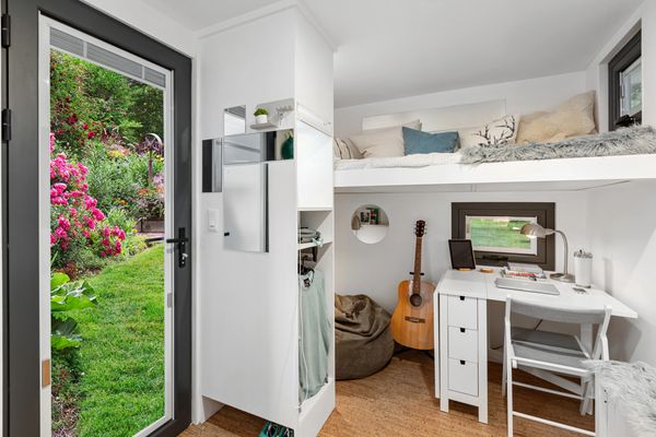 Interior view of the detachable ADU tiny home, bed and dining area
