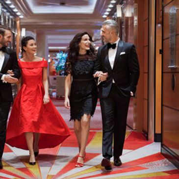 Two couples in evening attire aboard Cunard