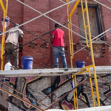 local masons restoring the west facade of The Forum (built 1897) in Chicago’s Bronzeville neighborho