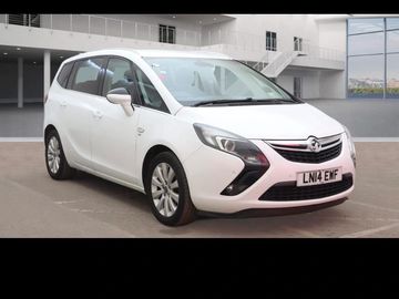 White Vauxhall Zafira parked indoors in a showroom.