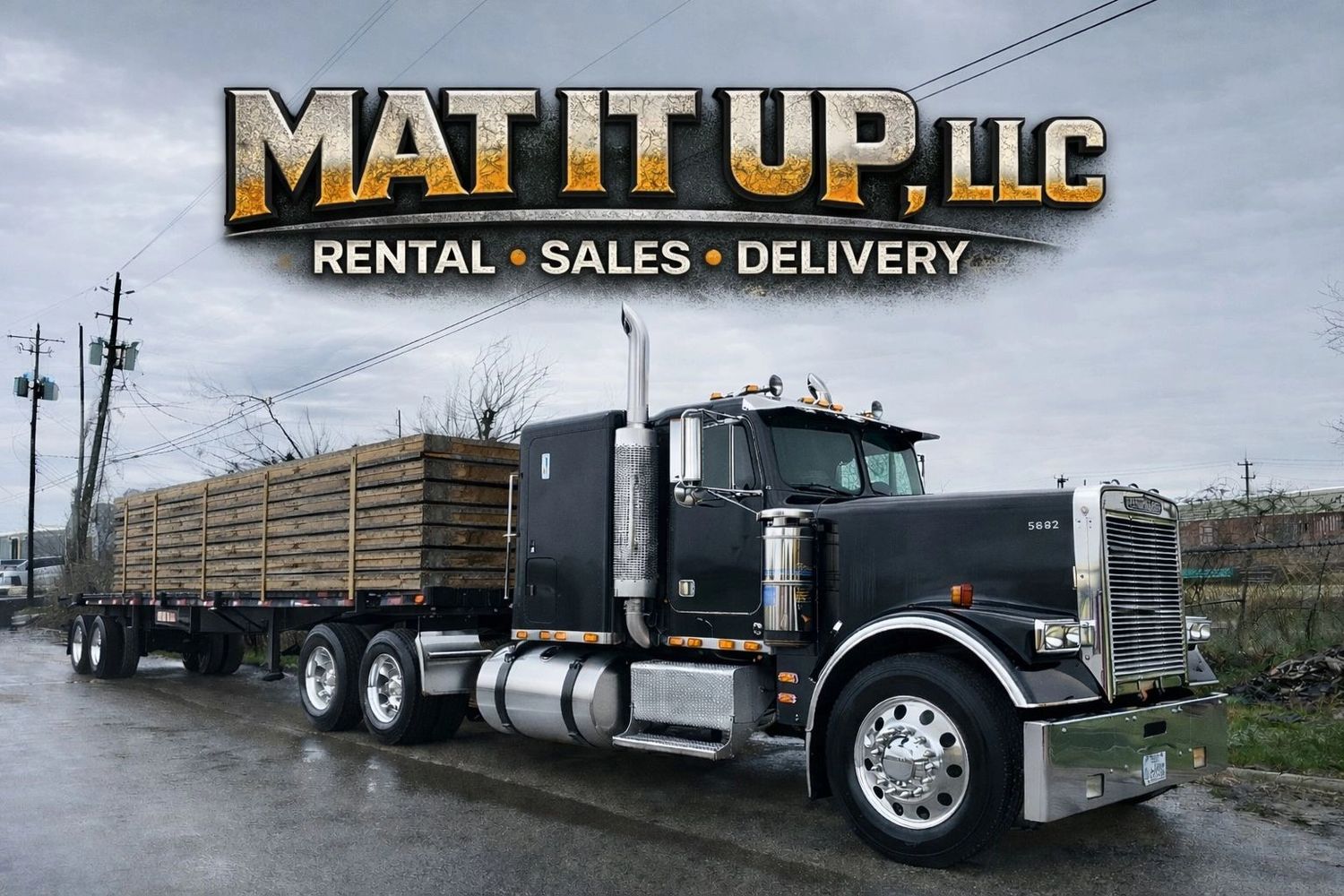 A black semi-truck with a wooden flatbed trailer under the logo MAT IT UP, LLC.