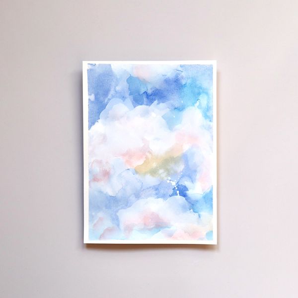 Watercolour and gouache atmospheric cloud painting in blues, white, pink and yellow by Renée Anne