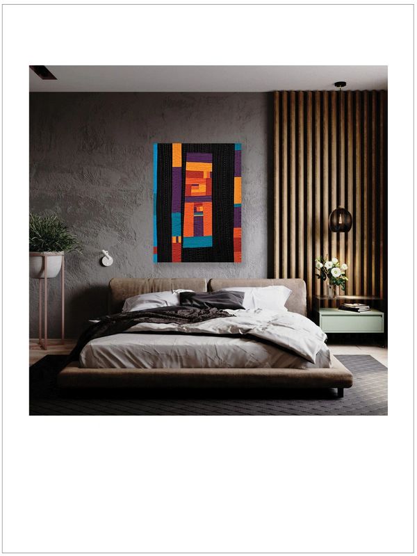 Modern bedroom with abstract wall art and wooden paneling.