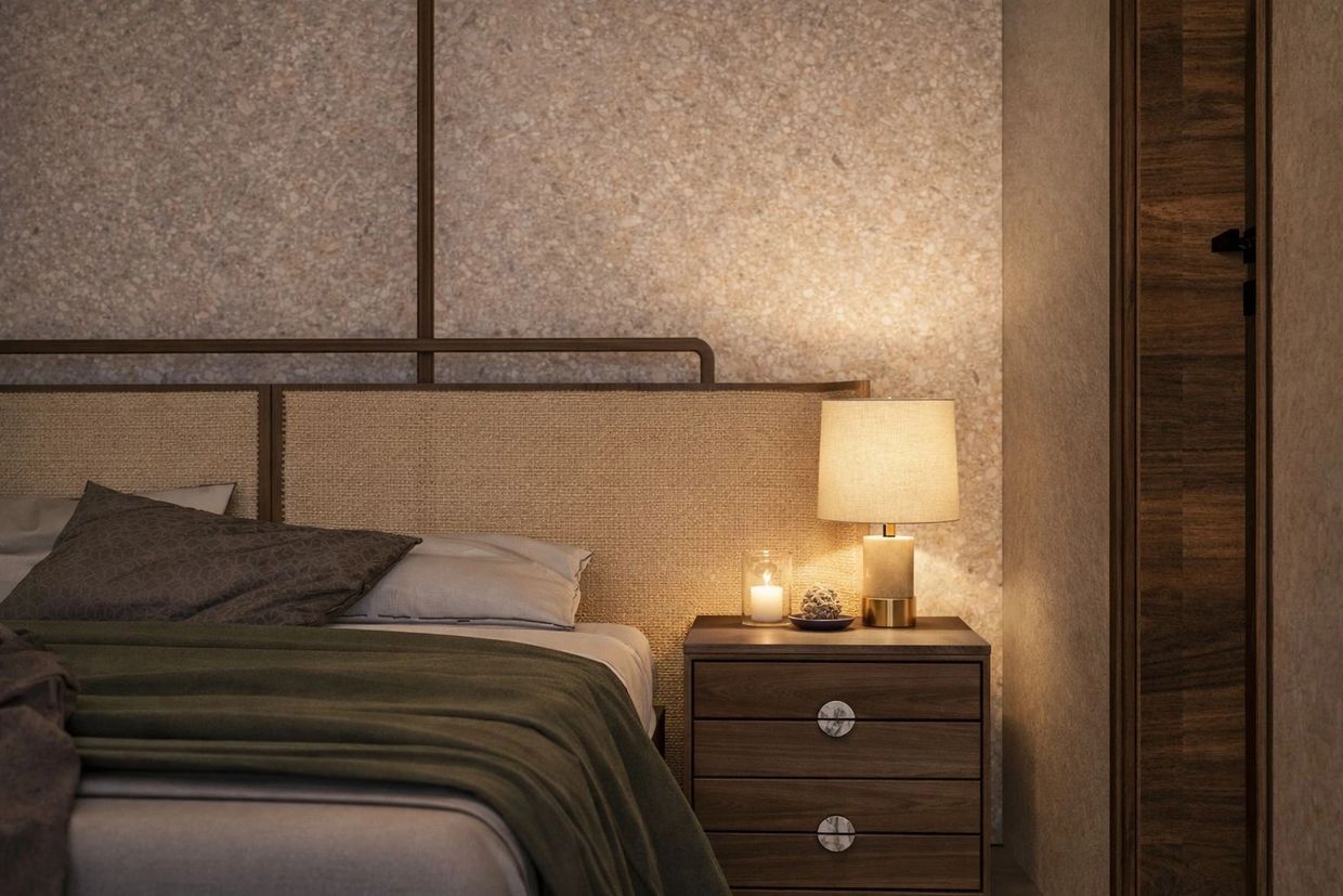 Cozy bedroom corner with warm lighting and wooden furniture.