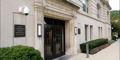 Entrance of a classical building with stone facade.