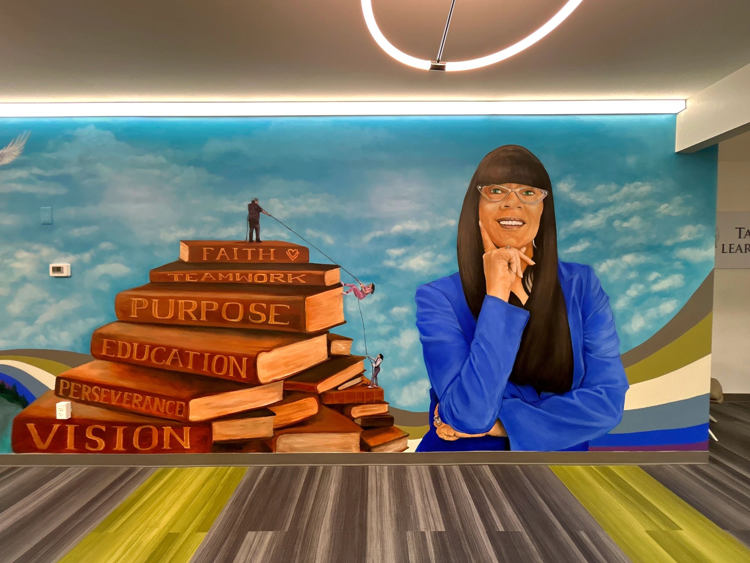 Mural Painting of Tania Barber and mountain of books