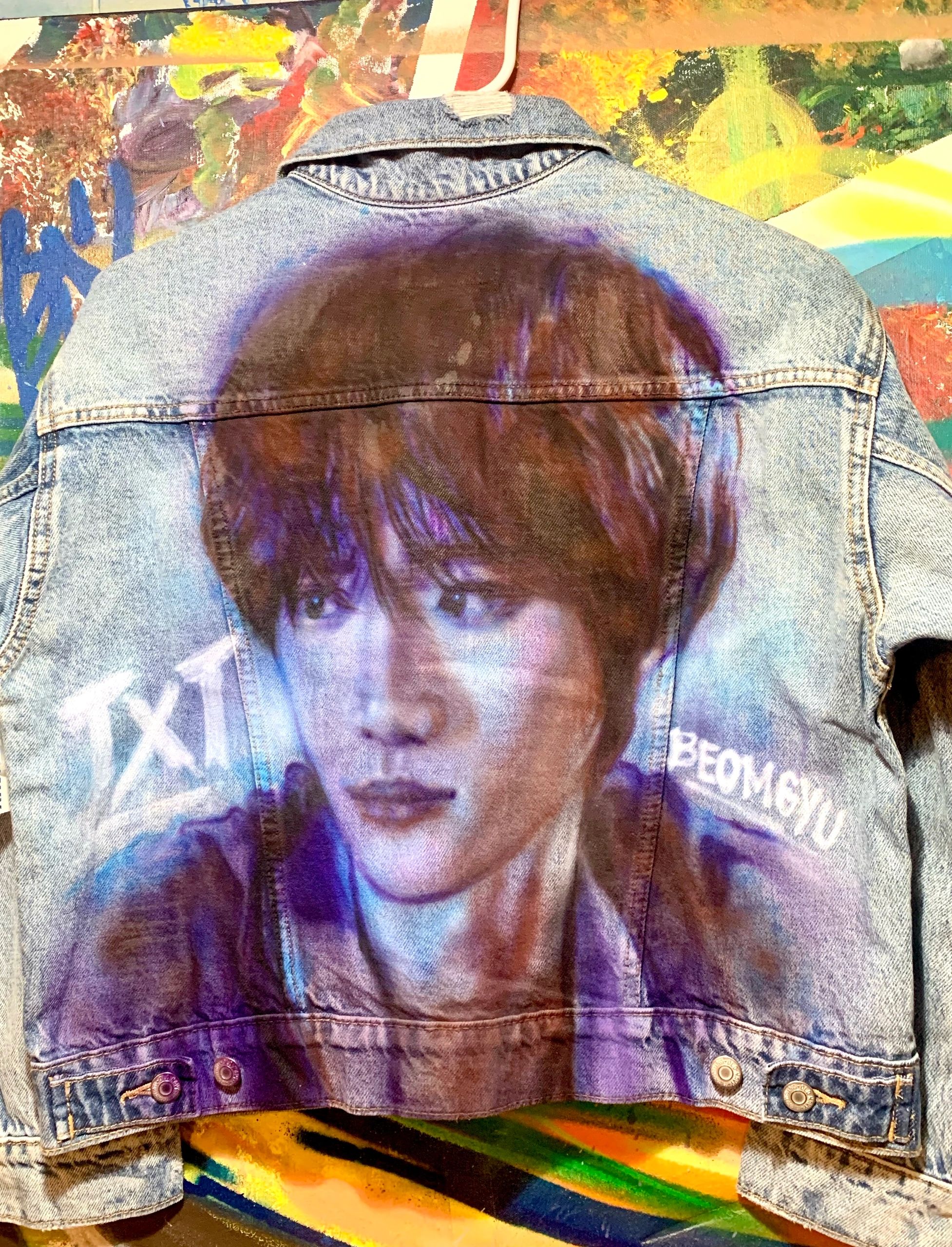 Painted portrait of txt member on denim jacket