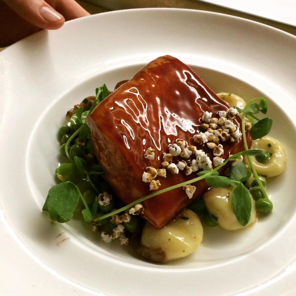 RAMP & CITRUS GLAZED SALMON, POTATO GNUDI, PEAS, POPPED SORGHUM BY CHEF DANIEL DIAZ