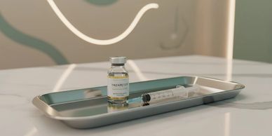 Vial and syringe on a medical tray.