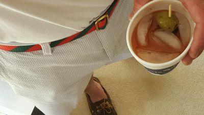 bowtie belts founder drinking a bloody mary while wearing the bowtie belts bloody merry