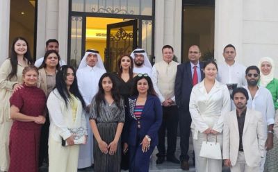 Group photo of diverse professionals in formal attire.