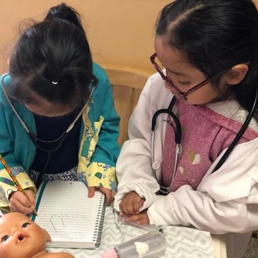 Kids making drawing and playing