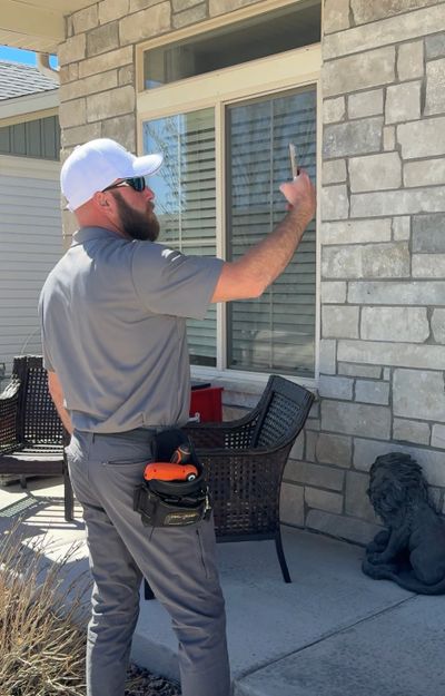 Professional home inspector performing an exterior home inspection in Colorado Springs, Colorado.