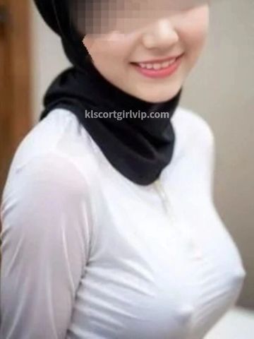 Professional business escort Sarah in corporate attire, KL's top multilingual VIP companion.